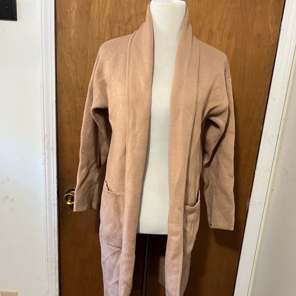 Worn a few times size medium tan jacket.